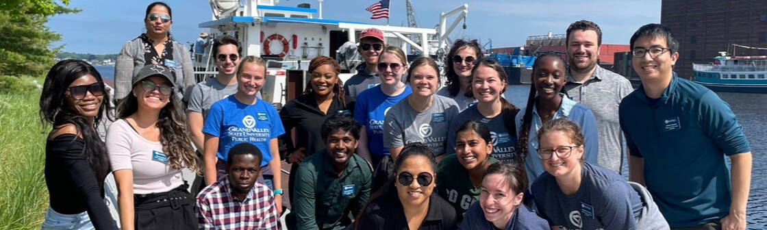 MPH students pose in front of AWRI's research vessel